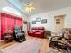Living room boasts comfortable seating and hardwood floors at 4817 Summerbridge Cir, Leesburg, FL 34748
