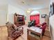 Relaxing living room featuring comfortable seating, a large TV, and a ceiling fan at 4817 Summerbridge Cir, Leesburg, FL 34748