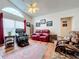 Living room with comfortable seating, hardwood floors, and open kitchen view at 4817 Summerbridge Cir, Leesburg, FL 34748