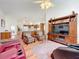 Living room with comfortable seating and view into kitchen at 4817 Summerbridge Cir, Leesburg, FL 34748