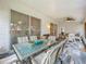 Relaxing screened porch with dining area and seating at 4817 Summerbridge Cir, Leesburg, FL 34748