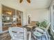 Covered screened porch with patio furniture and view of living room at 4817 Summerbridge Cir, Leesburg, FL 34748