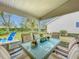 Enjoyable screened porch with dining set and backyard access at 4817 Summerbridge Cir, Leesburg, FL 34748
