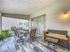 Spacious screened porch with dining table and seating at 4817 Summerbridge Cir, Leesburg, FL 34748