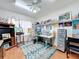 Art studio with easel, desk, and plenty of storage at 4817 Summerbridge Cir, Leesburg, FL 34748