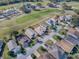 Aerial view showing home's location in a golf course community at 520 Grand Vista Trl, Leesburg, FL 34748