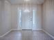 Tiled entryway with neutral walls and a white door at 520 Grand Vista Trl, Leesburg, FL 34748