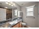 Clean bathroom with dark vanity and shower at 5312 Galley Way, Oxford, FL 34484