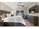 Spacious Primary bedroom with large bed, dresser, and ceiling fan at 5312 Galley Way, Oxford, FL 34484