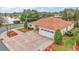 Single-story home with a two-car garage and landscaped yard at 5312 Galley Way, Oxford, FL 34484