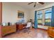 Home office with mid-century desk, chair, and view of the backyard at 8100 Conway Rd, Yalaha, FL 34797