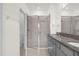 Elegant bathroom with granite countertops and walk-in shower at 8128 Penrose Pl, Wildwood, FL 34785