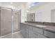 Modern bathroom with granite countertops and walk-in shower at 8128 Penrose Pl, Wildwood, FL 34785