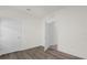 Simple bedroom with wood-look floors and an open feel at 8128 Penrose Pl, Wildwood, FL 34785