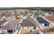 Aerial view of a home's backyard with patio and landscaping at 9224 Se 167Th Ford St, The Villages, FL 32162