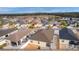Aerial view highlighting home's backyard and surrounding homes at 9224 Se 167Th Ford St, The Villages, FL 32162