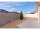 Backyard with gravel, small tree and concrete patio at 9224 Se 167Th Ford St, The Villages, FL 32162