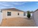 Landscaped backyard with gravel and privacy fence at 9224 Se 167Th Ford St, The Villages, FL 32162