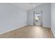 Charming bedroom with wood-look floors and a large window with blinds at 9224 Se 167Th Ford St, The Villages, FL 32162