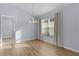Dining room with chandelier and neutral colored walls at 9224 Se 167Th Ford St, The Villages, FL 32162