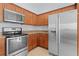 Modern kitchen with stainless steel appliances at 9224 Se 167Th Ford St, The Villages, FL 32162