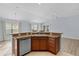 Kitchen with island and stainless steel dishwasher at 9224 Se 167Th Ford St, The Villages, FL 32162