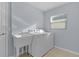 Bright laundry room with washer, dryer, and utility sink at 9224 Se 167Th Ford St, The Villages, FL 32162