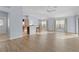 Open living room and kitchen with hardwood floors at 9224 Se 167Th Ford St, The Villages, FL 32162