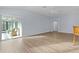 Living room with sliding doors leading to a screened porch at 9224 Se 167Th Ford St, The Villages, FL 32162