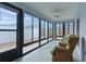 Relaxing sunroom featuring ample natural light and comfortable seating at 9224 Se 167Th Ford St, The Villages, FL 32162