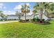 Single-story house with landscaped yard and palm trees at 10282 Julia Isles Ave, Oxford, FL 34484