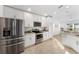 Modern kitchen with stainless steel appliances and white cabinets at 10282 Julia Isles Ave, Oxford, FL 34484