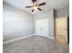 Spacious bedroom with double doors and ceiling fan at 1216 Zeek Ridge St, Clermont, FL 34715