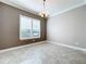 Dining room with tile floors, neutral walls, and a chandelier at 1216 Zeek Ridge St, Clermont, FL 34715