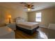 Bright bedroom with a double bed, nightstand, and ceiling fan at 1431 Mohawk Cir, Tavares, FL 32778