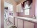 Lavender bathroom with shower/tub combo and vanity at 1559 Nassau Cir, Tavares, FL 32778