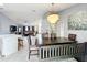 Bright dining room with a chandelier and seating for six at 170 Hidden Pointe Ln, Groveland, FL 34736