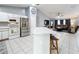 Modern kitchen with stainless steel appliances and white cabinets at 170 Hidden Pointe Ln, Groveland, FL 34736