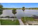 Serene lakefront view with dock and lush vegetation at 170 Hidden Pointe Ln, Groveland, FL 34736