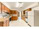 Bright kitchen with wood cabinets and appliances at 1801 Vine St, Leesburg, FL 34748
