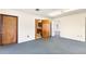 Open office space with kitchen access and carpet flooring at 1801 Vine St, Leesburg, FL 34748