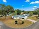 Single-story home with spacious yard, driveway and mature trees at 17925 Se 100Th Ter, Summerfield, FL 34491