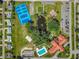 Community overview featuring tennis courts, pond, clubhouse, and parking at 17925 Se 100Th Ter, Summerfield, FL 34491