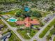 Aerial view of community with clubhouse, pool, and tennis courts at 17925 Se 100Th Ter, Summerfield, FL 34491