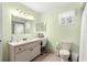 Clean bathroom featuring a vanity, toilet and shower/tub combo at 17925 Se 100Th Ter, Summerfield, FL 34491