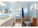 Simple bathroom with toilet and vanity; view into bedroom at 17925 Se 100Th Ter, Summerfield, FL 34491