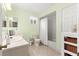 Guest bathroom with light green walls and tub/shower at 17925 Se 100Th Ter, Summerfield, FL 34491