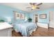 Serene bedroom with white bed frame and blue bedding at 17925 Se 100Th Ter, Summerfield, FL 34491