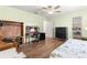 Bedroom with wood floors, a bed, and ample closet space at 17925 Se 100Th Ter, Summerfield, FL 34491