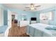 Guest bedroom with white furniture and light blue bedding at 17925 Se 100Th Ter, Summerfield, FL 34491
